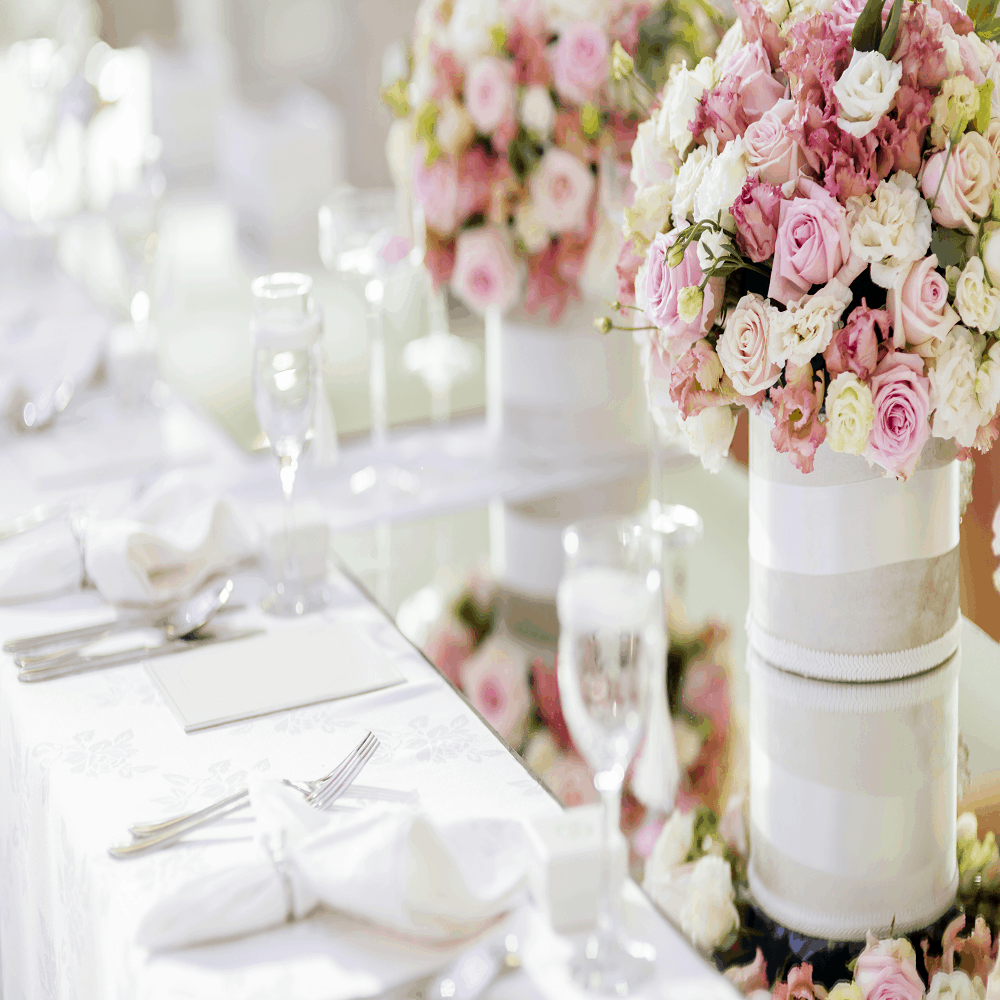 Beautiful wedding decoration with roses and a luxurious table setting